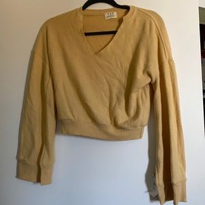 Selling a soft/pastel yellow sweater crop top. Nordstrom never worn with tags.